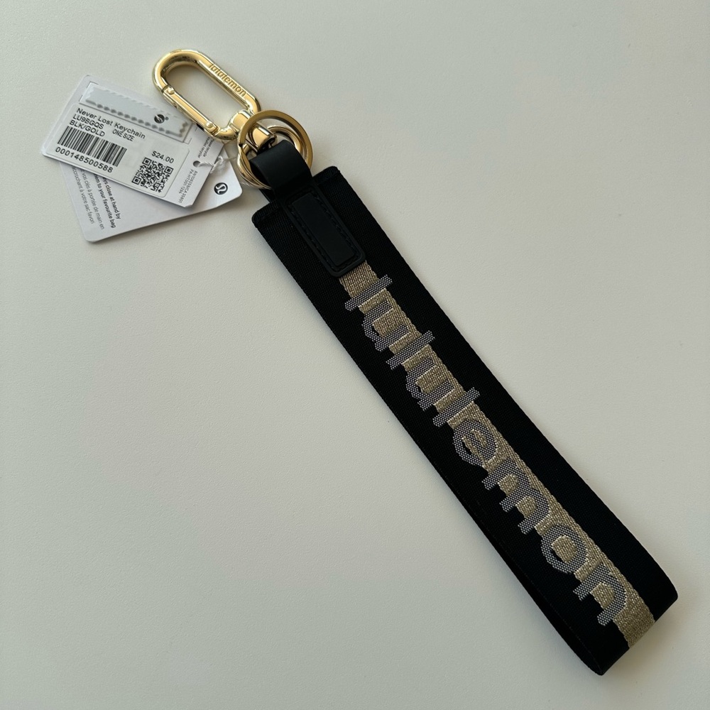 NWT Lululemon never lost key chain black and gold